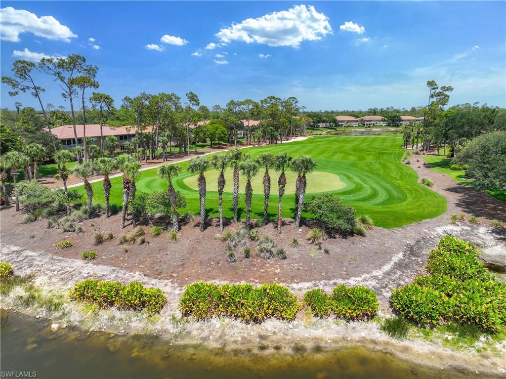 3589 Periwinkle Way Naples, FL 34114 - Photo 25 of 39 a view of a yard with a lake view