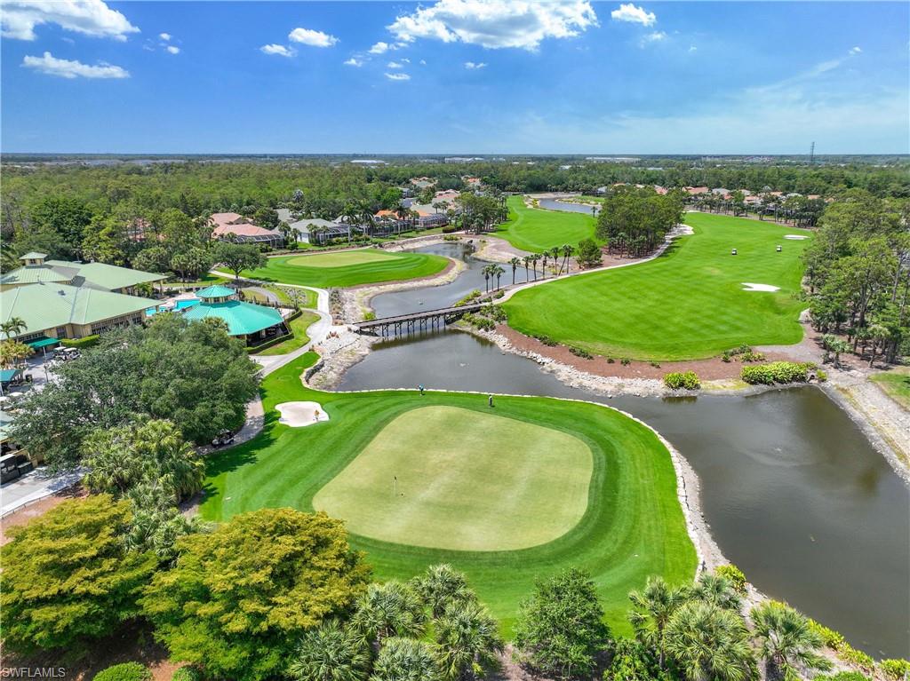 3589 Periwinkle Way Naples, FL 34114 - Photo 26 of 39 an aerial view of a residential houses with outdoor space and a lake view in back