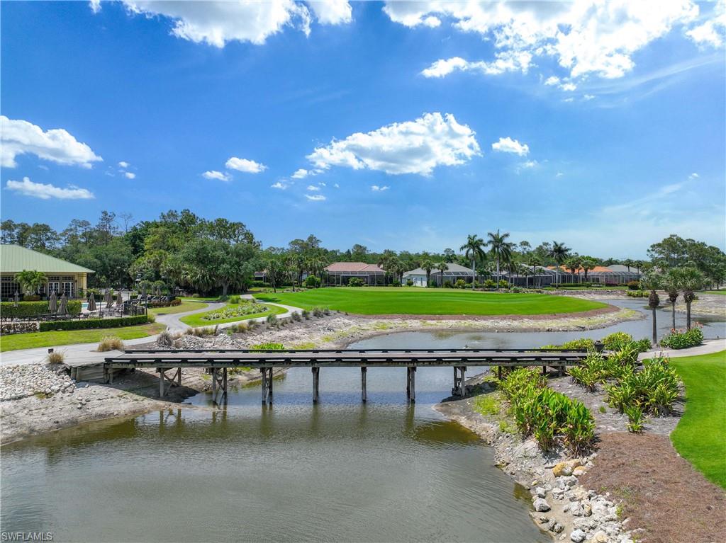 3589 Periwinkle Way Naples, FL 34114 - Photo 28 of 39 a view of swimming pool with outdoor seating