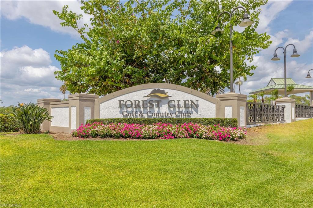 3589 Periwinkle Way Naples, FL 34114 - Photo 39 of 39 a front view of yellow house with a yard
