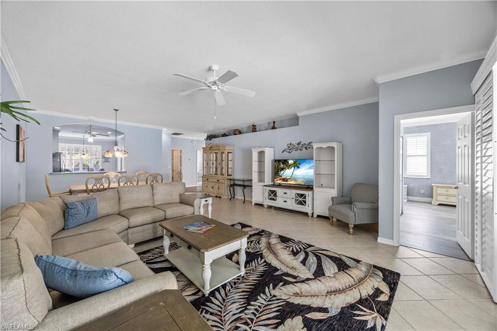 3589 Periwinkle Way Naples, FL 34114 - Photo 6 of 39 a living room with furniture or couch and a view of kitchen