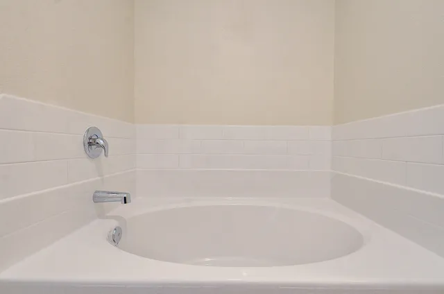 a close up of a bathtub in a bathroom