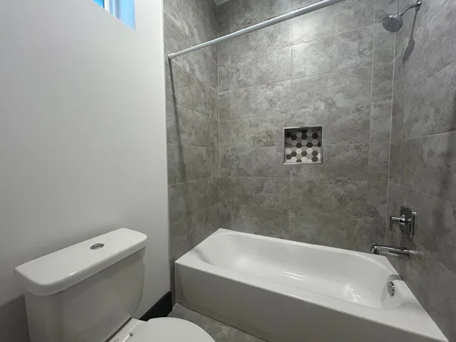 a bathroom with a sink a toilet and a bathtub