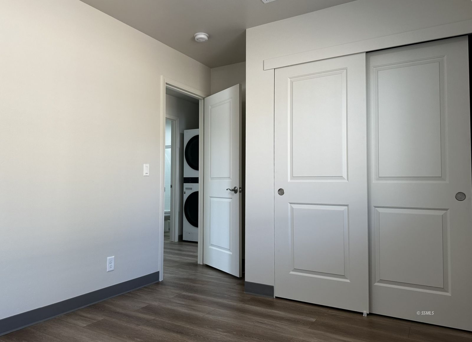 1424 South Farragut Street Ridgecrest, CA 93555 - Photo 12 of 13 an empty room with wooden floor & closet area