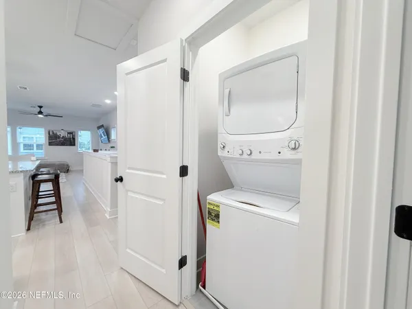 a view of kitchen with furniture and wooden floor