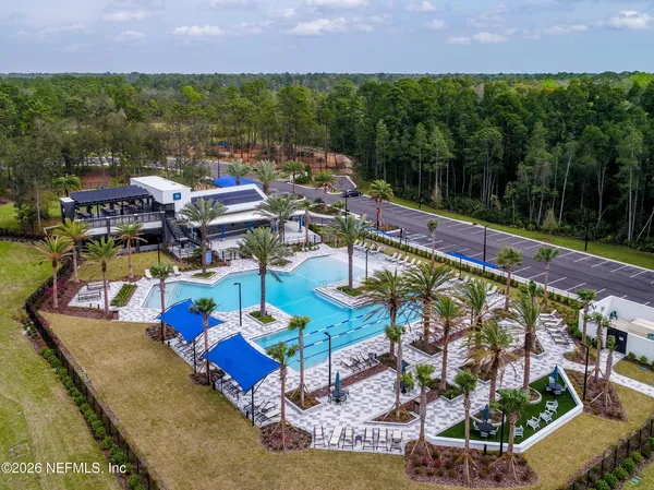 a view of lawn chairs under an umbrella