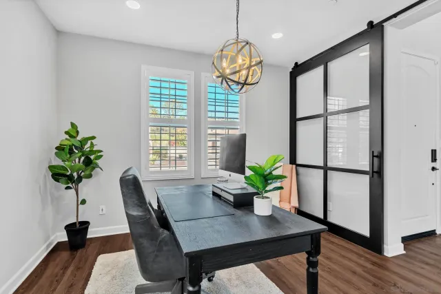 a kitchen with stainless steel appliances a refrigerator sink and cabinets