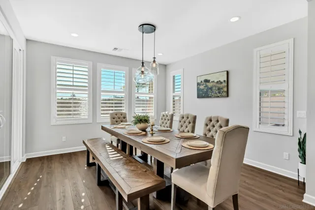 a living room with furniture and view of kitchen