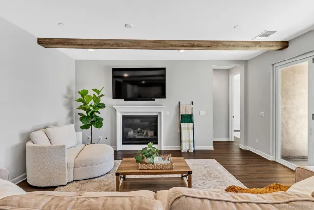 a view of an empty room and wooden floor
