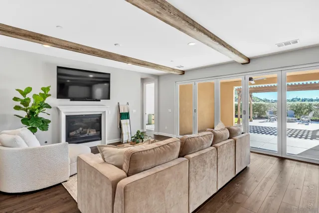 a bathroom with a granite countertop toilet sink and mirror