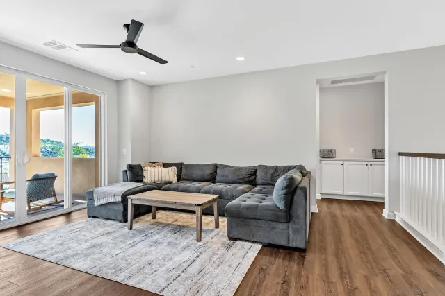 a bedroom with furniture and flat screen tv