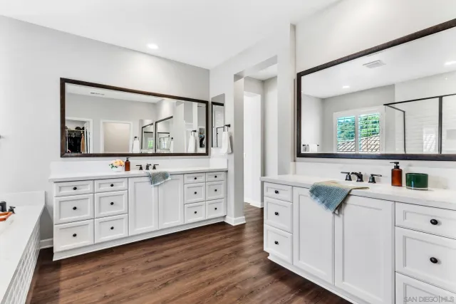 a view of entryway with a window and a ceiling fan