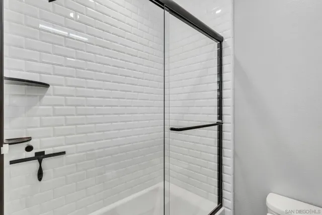 a view of swimming pool with a patio and a yard