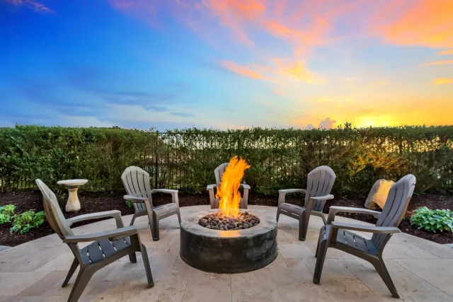 a view of a sink a table and chairs in a patio