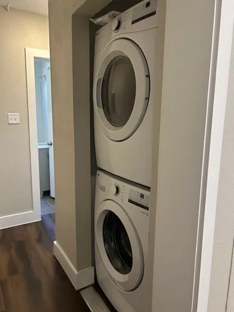 a kitchen with wooden floors and appliances