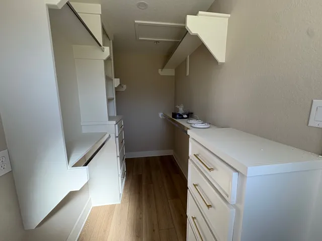 a view of a storage and utility room with stairs
