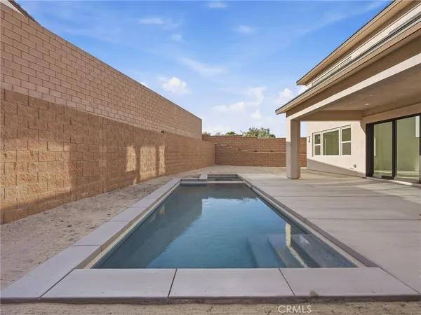 a view of a swimming pool with a chair