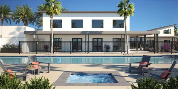 a view of a house with backyard and sitting area