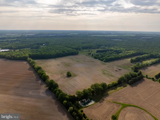 an aerial view of a houses with outdoor space