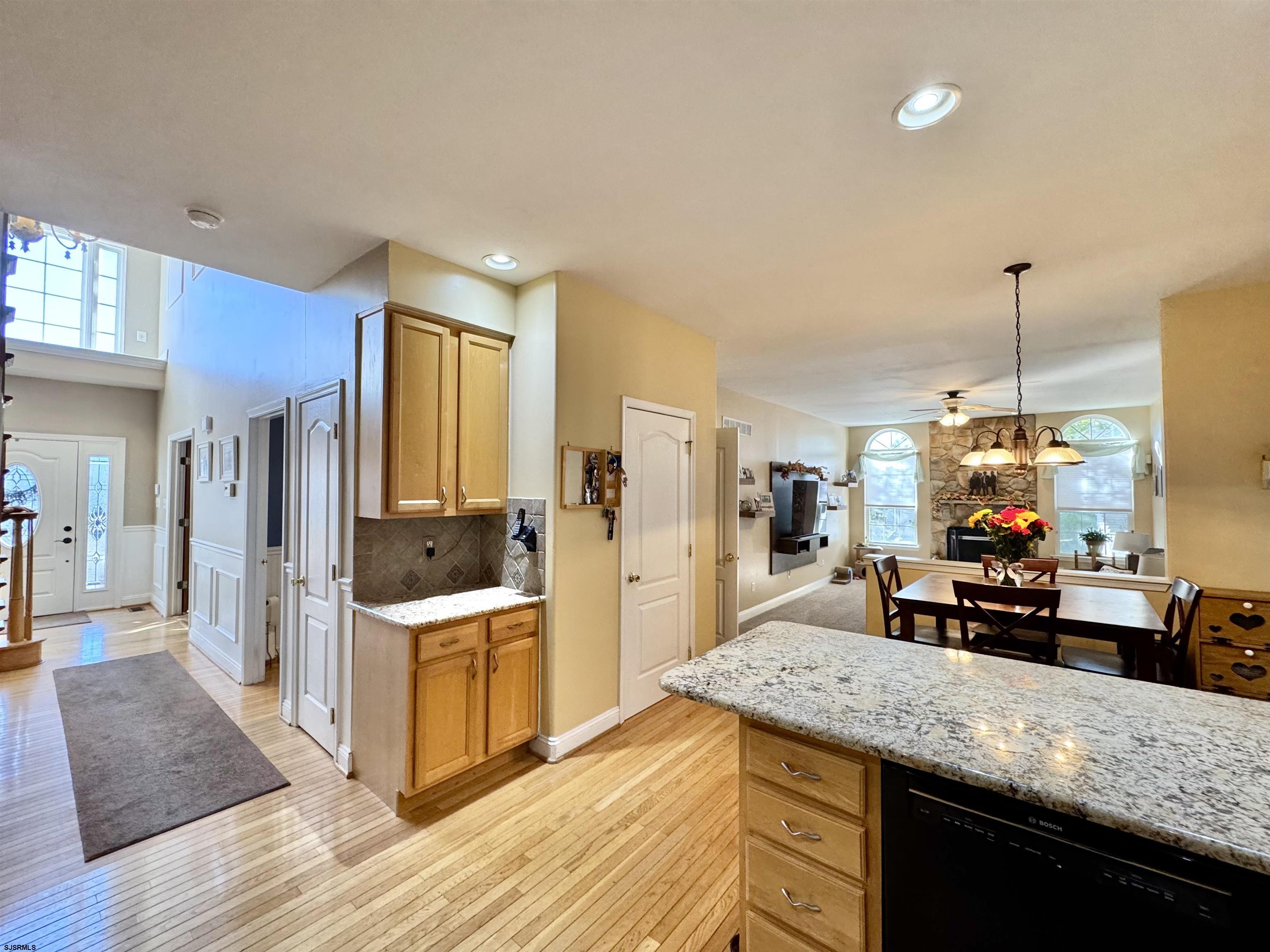 215 Prancer Road Egg Harbor Township, NJ 08234 - Photo 11 of 46 a kitchen with stainless steel appliances granite countertop a sink dishwasher and a stove with wooden floor