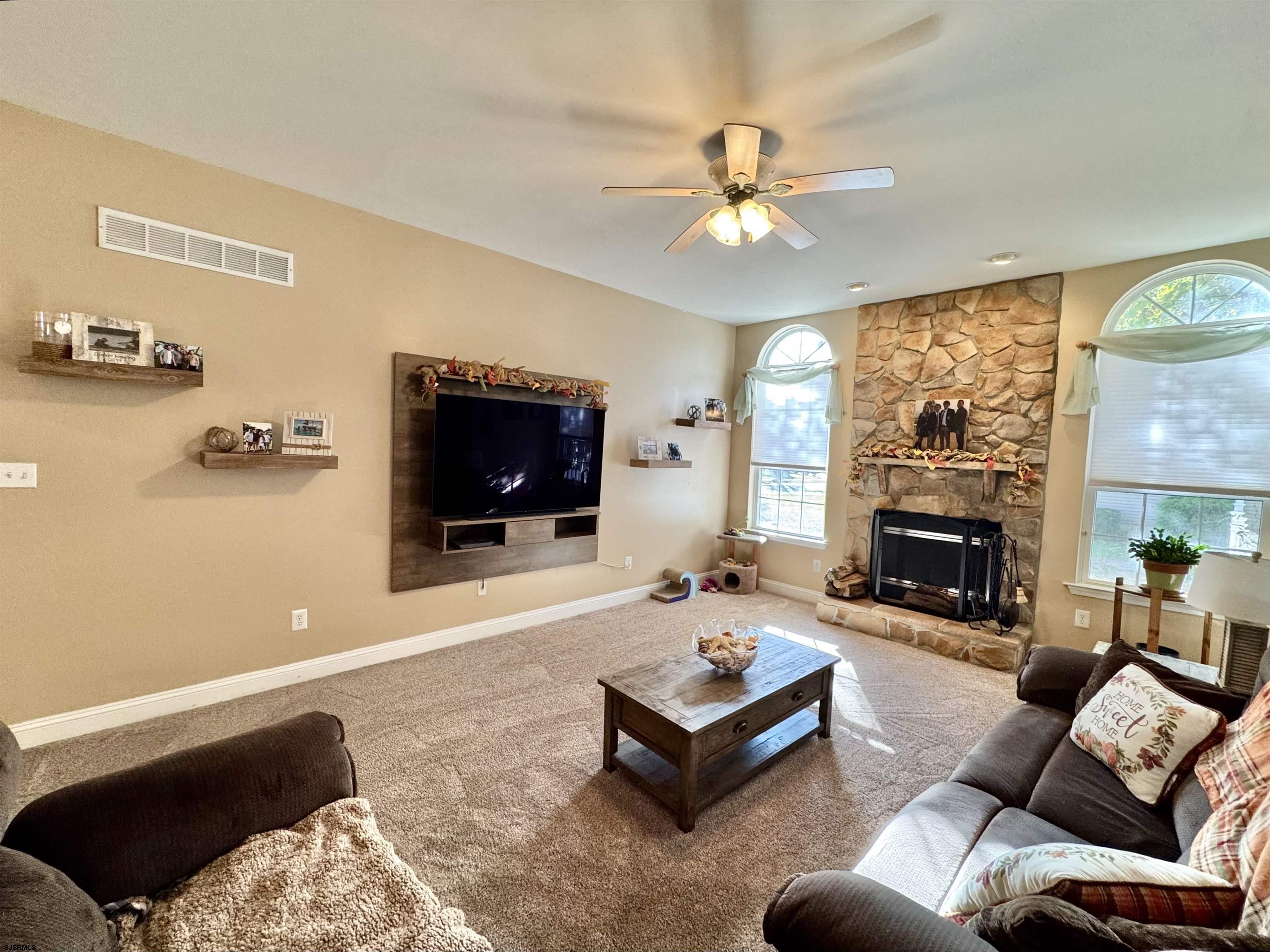 215 Prancer Road Egg Harbor Township, NJ 08234 - Photo 15 of 46 a living room with furniture and a flat screen tv