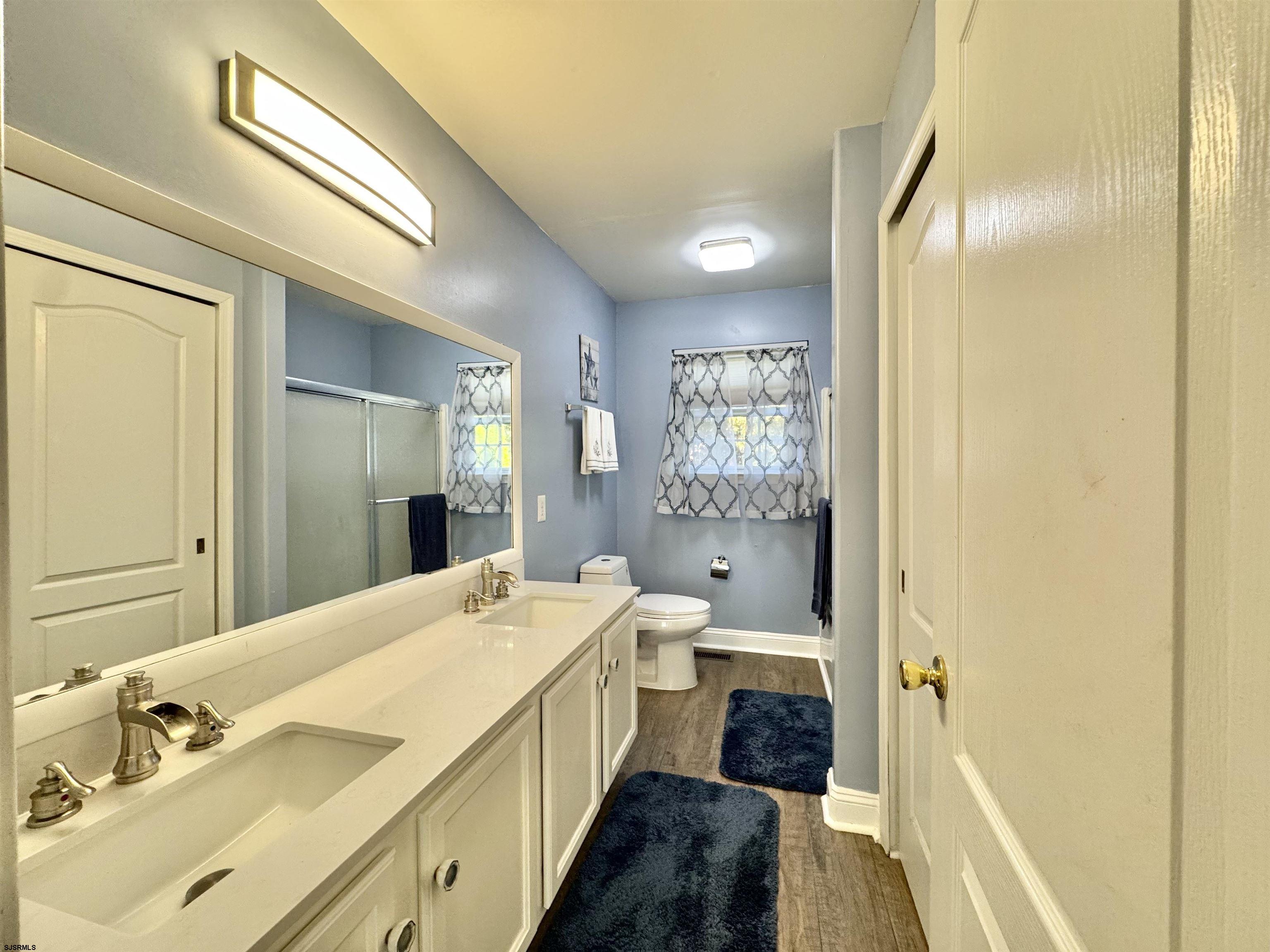 215 Prancer Road Egg Harbor Township, NJ 08234 - Photo 18 of 46 a spacious bathroom with a double vanity sink and a mirror