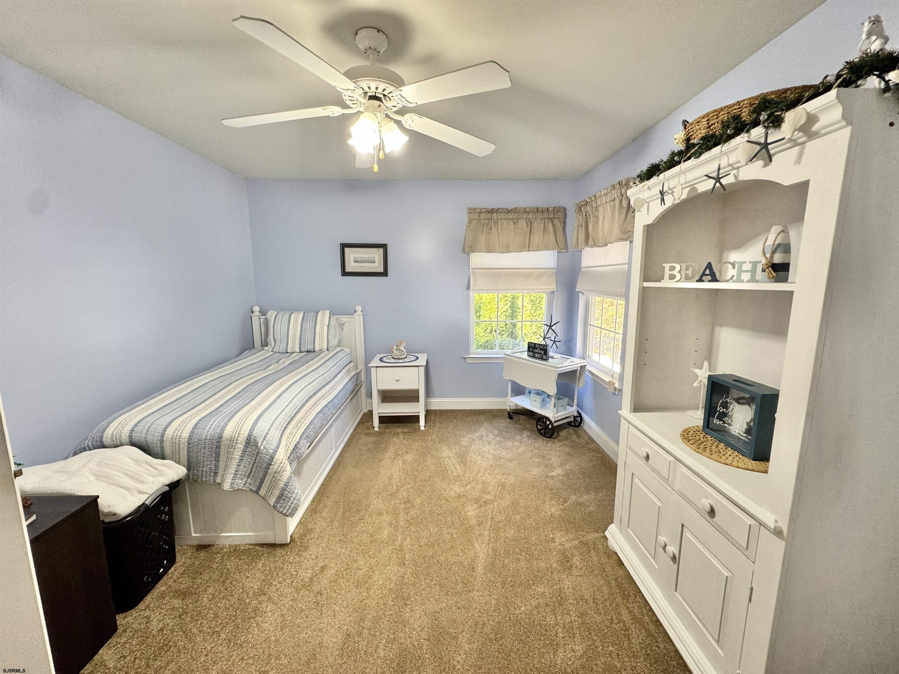 215 Prancer Road Egg Harbor Township, NJ 08234 - Photo 20 of 46 a spacious bedroom with a bed and a chandelier