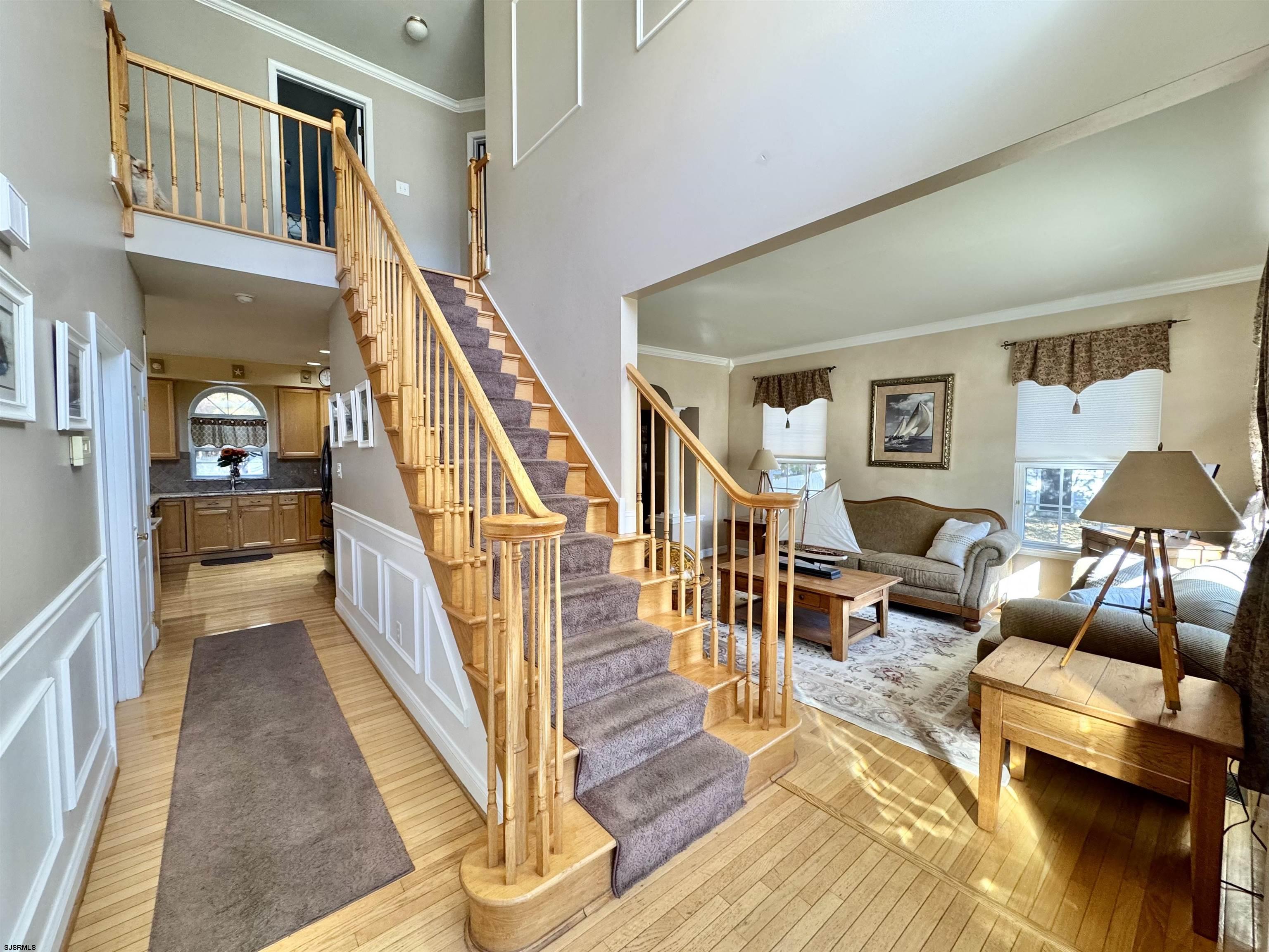 215 Prancer Road Egg Harbor Township, NJ 08234 - Photo 2 of 46 a living room with furniture and a wooden floor