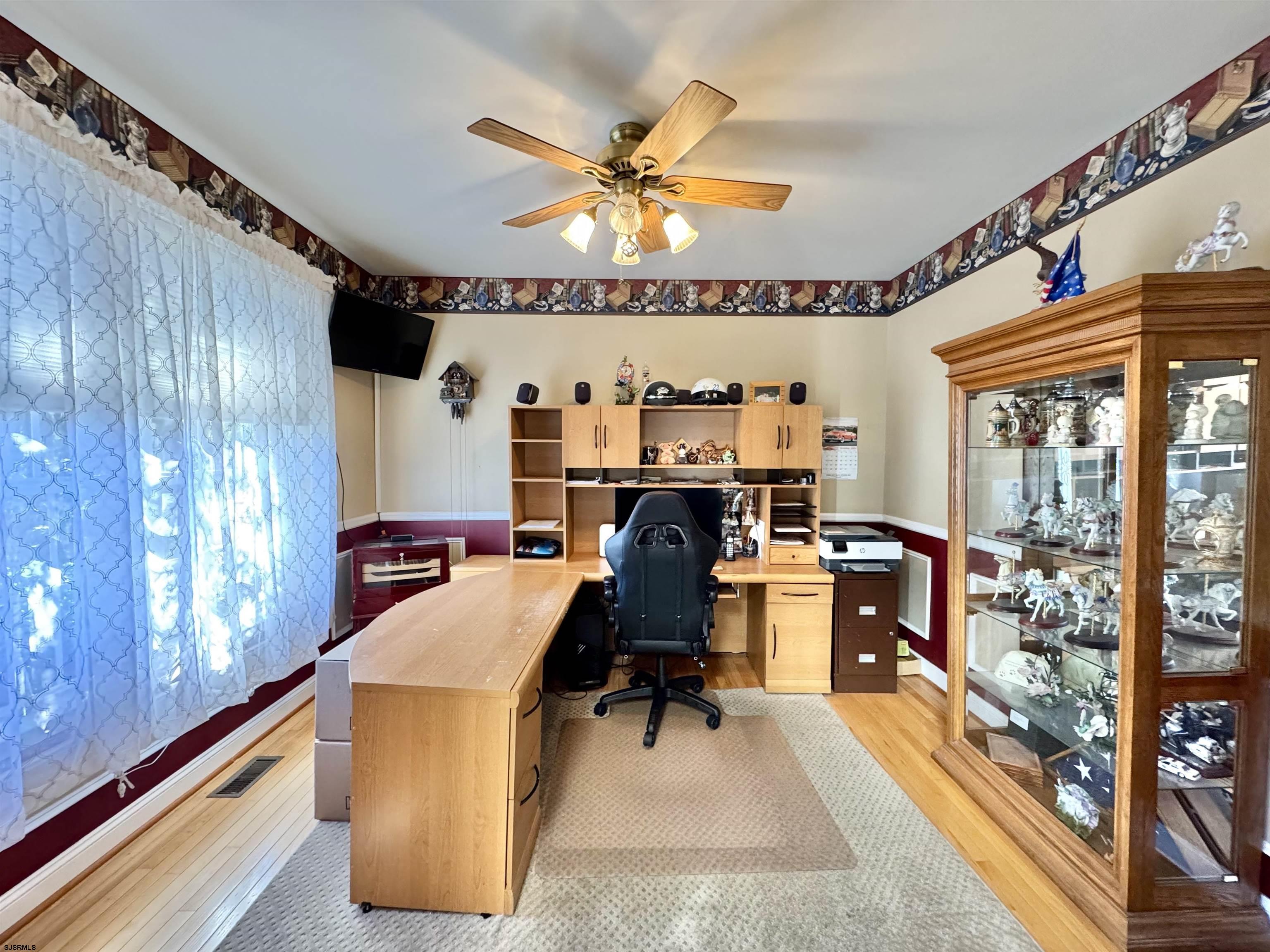215 Prancer Road Egg Harbor Township, NJ 08234 - Photo 3 of 46 a view of a workspace with furniture and a window