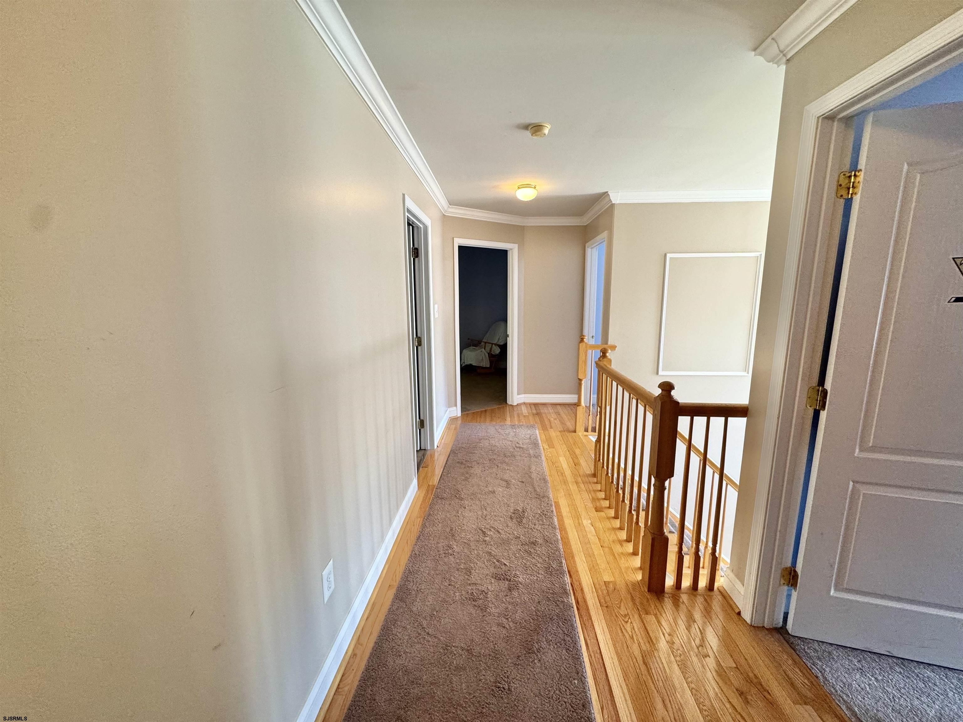 215 Prancer Road Egg Harbor Township, NJ 08234 - Photo 32 of 46 a view of a hallway with wooden floor and staircase