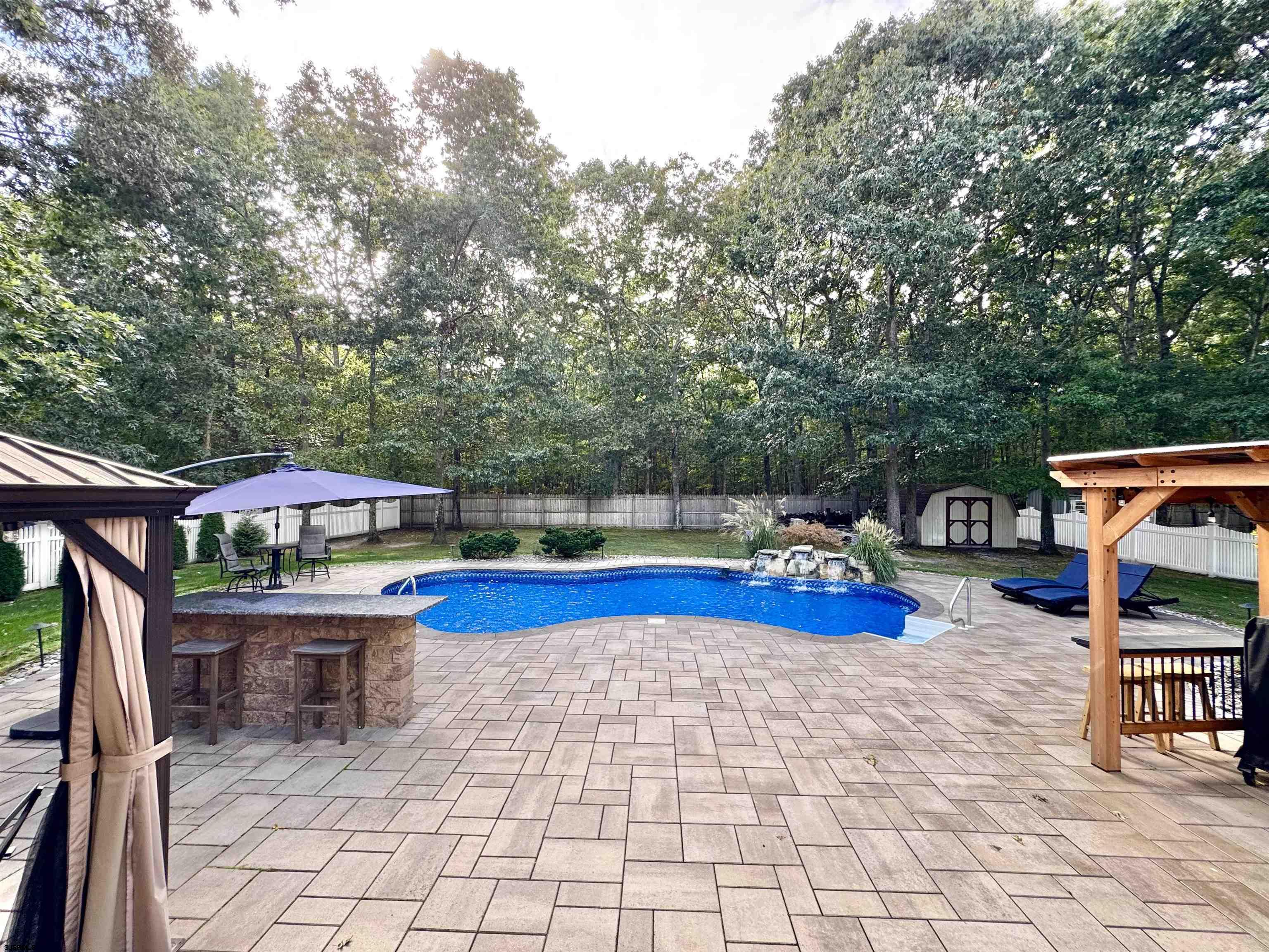 215 Prancer Road Egg Harbor Township, NJ 08234 - Photo 37 of 46 a view of swimming pool with sitting area and furniture