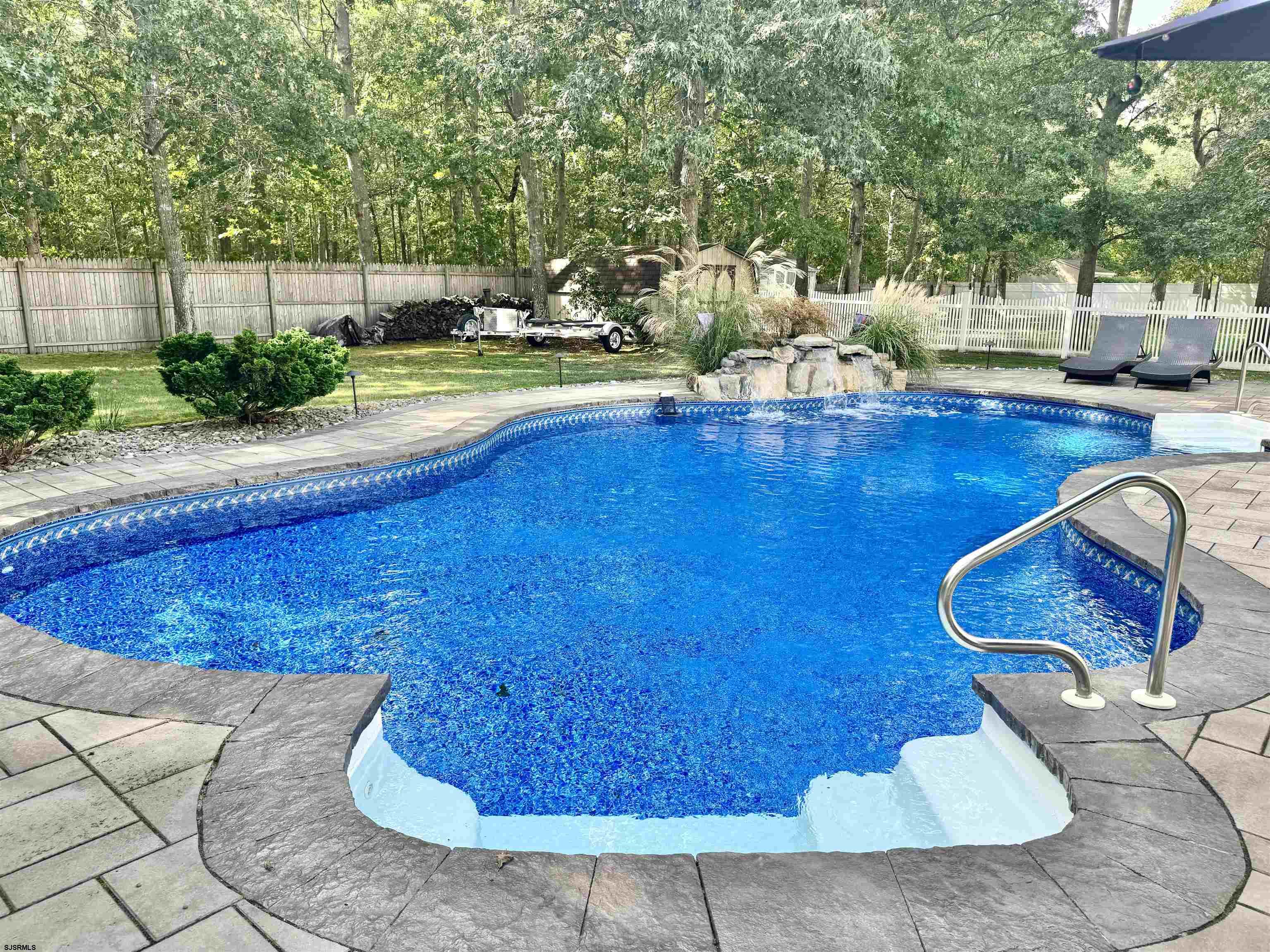215 Prancer Road Egg Harbor Township, NJ 08234 - Photo 38 of 46 a view of a swimming pool with an outdoor seating