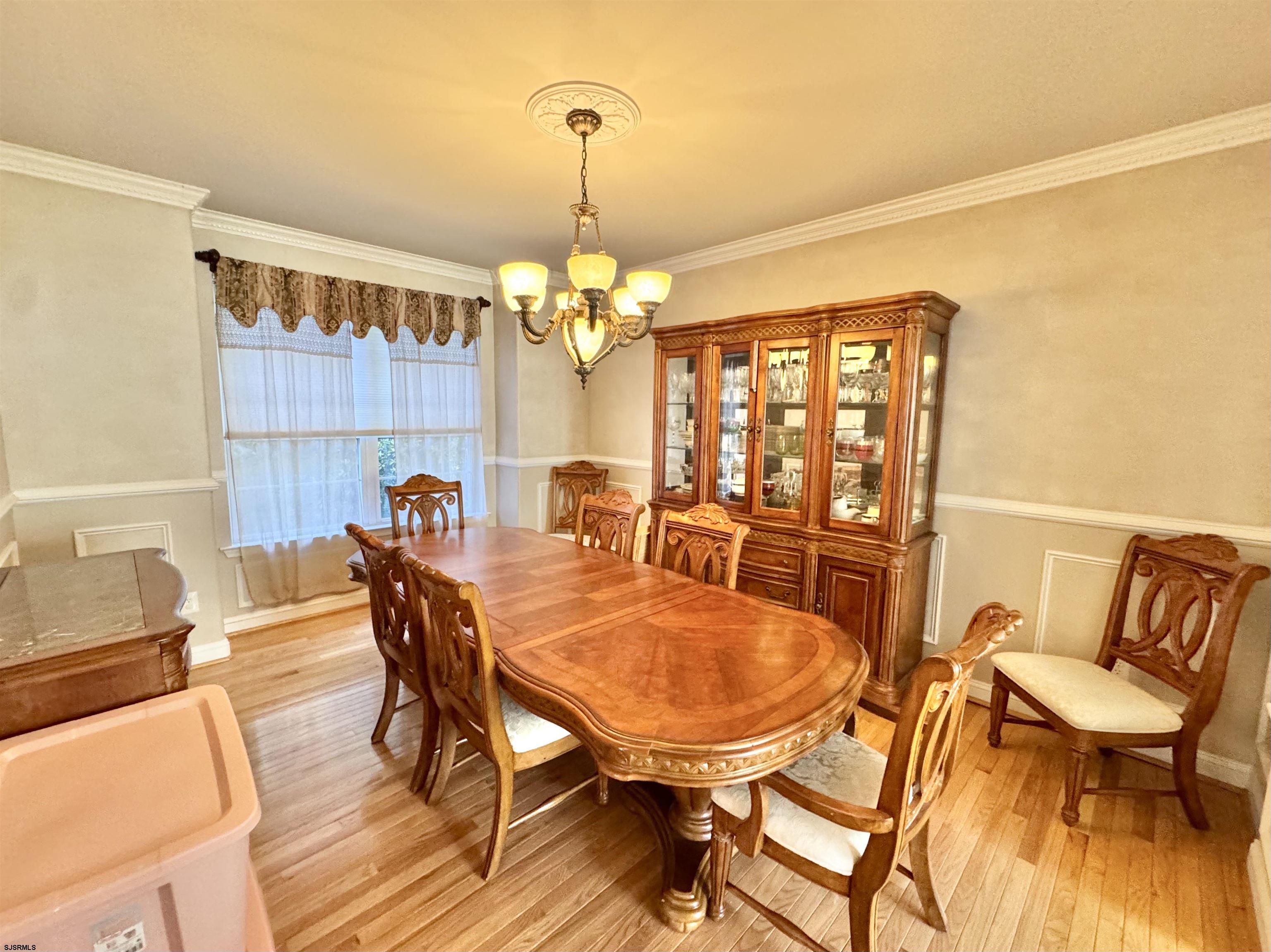 215 Prancer Road Egg Harbor Township, NJ 08234 - Photo 7 of 46 a view of a dining room with furniture and chandelier