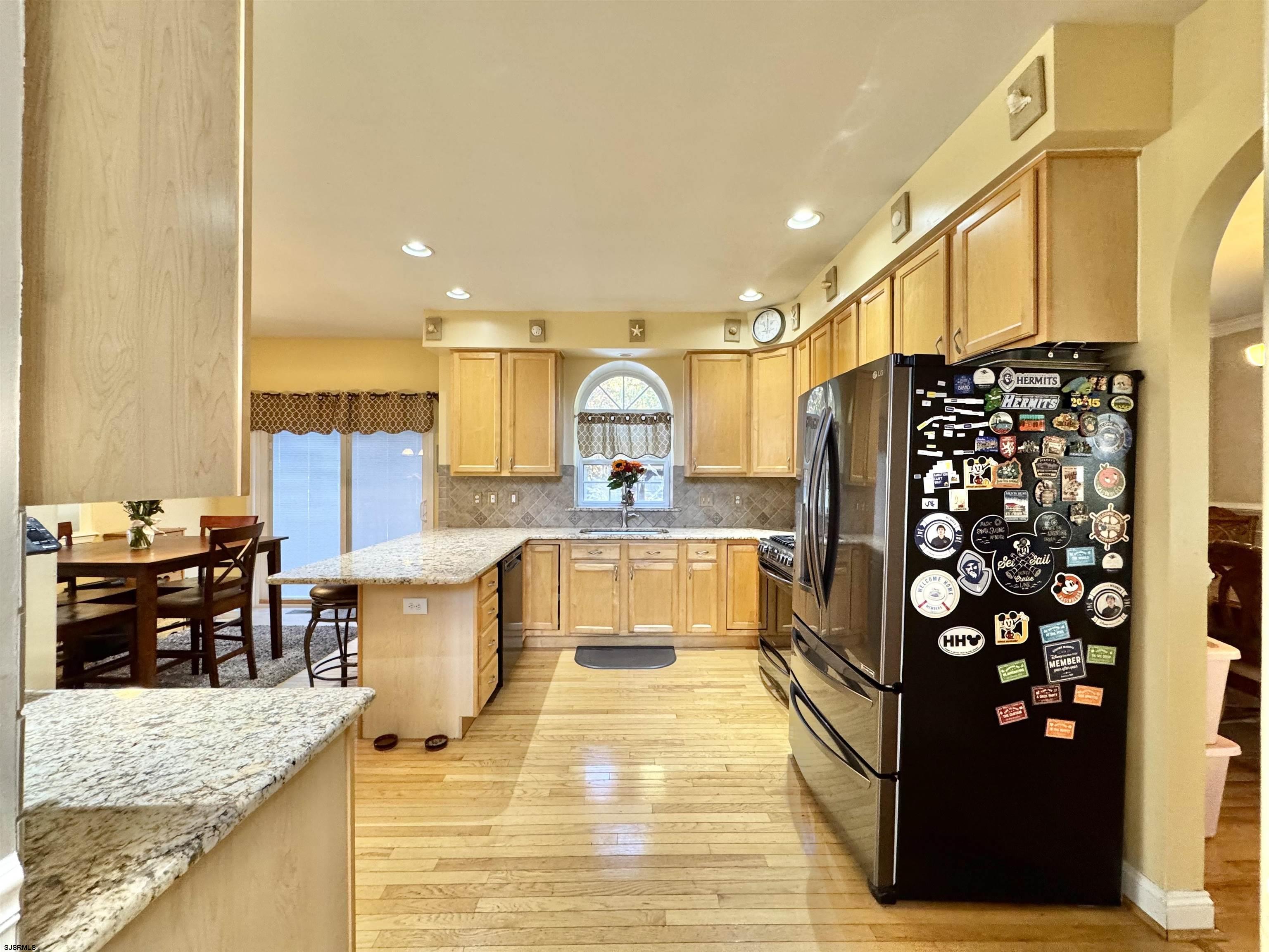 215 Prancer Road Egg Harbor Township, NJ 08234 - Photo 9 of 46 a large kitchen with stainless steel appliances kitchen island granite countertop a refrigerator and a stove