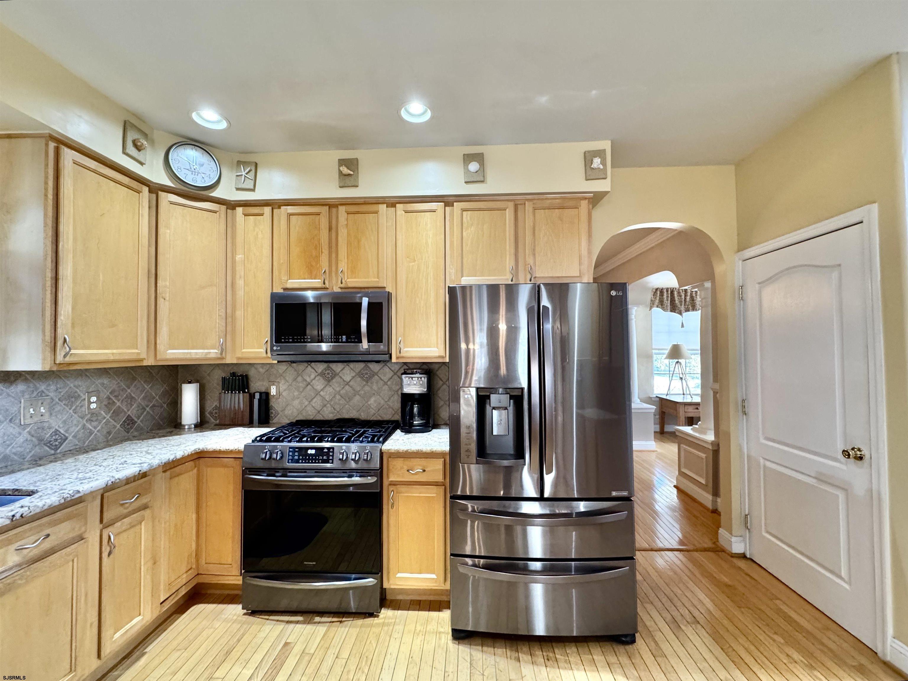 215 Prancer Road Egg Harbor Township, NJ 08234 - Photo 10 of 46 a kitchen with stainless steel appliances granite countertop a refrigerator a stove and a sink