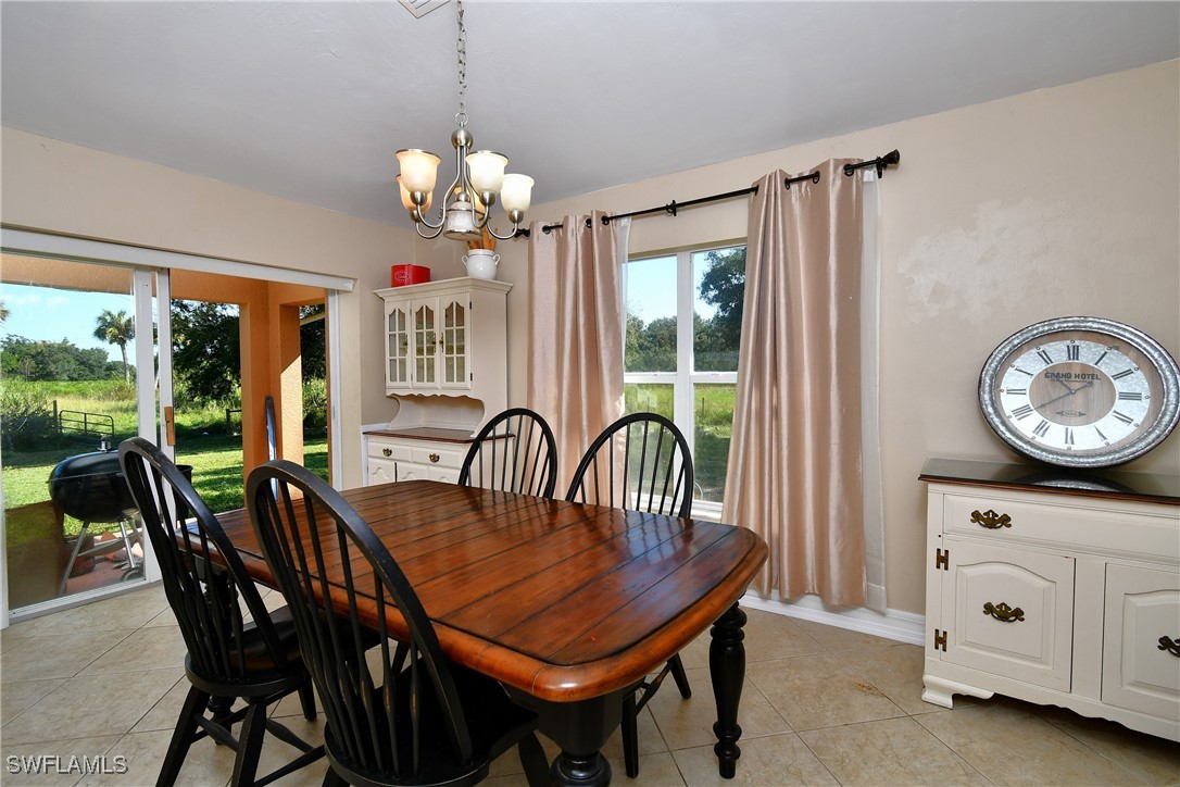 2751 Styles Road Alva, FL 33920 - Photo 15 of 31 a view of a dining room with furniture window and outside view