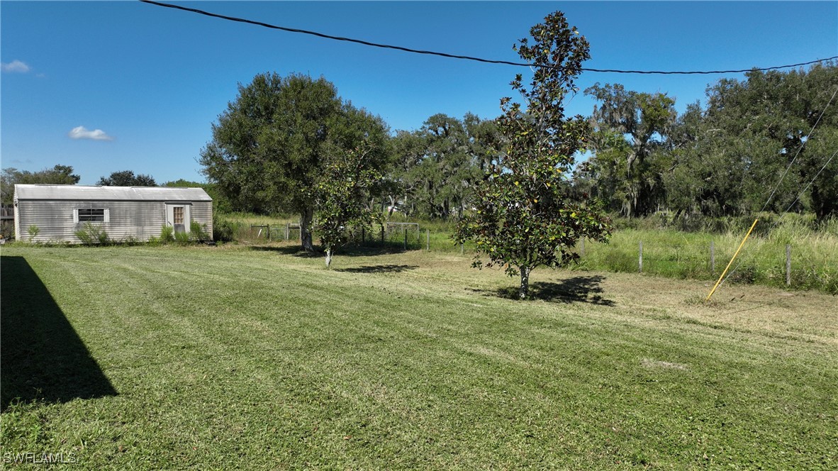 2751 Styles Road Alva, FL 33920 - Photo 5 of 31 a view of a house with a yard