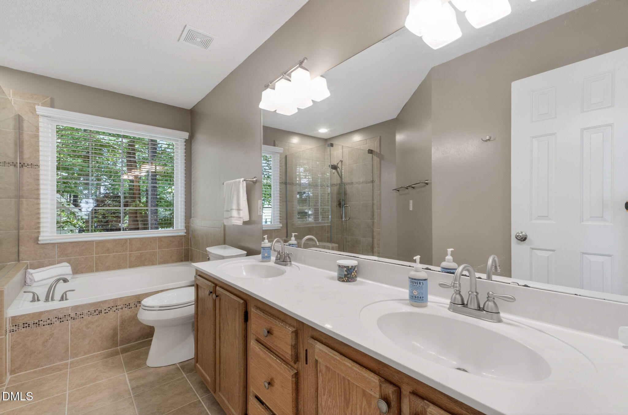 12113 Townmeade Court Raleigh, NC 27613 - Photo 26 of 39 Dual sink, large tub and separate shower.