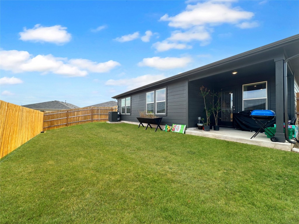 730 Gladiola Loop Kyle, TX 78640 - Photo 12 of 13 Fenced backyard featuring a patio area
