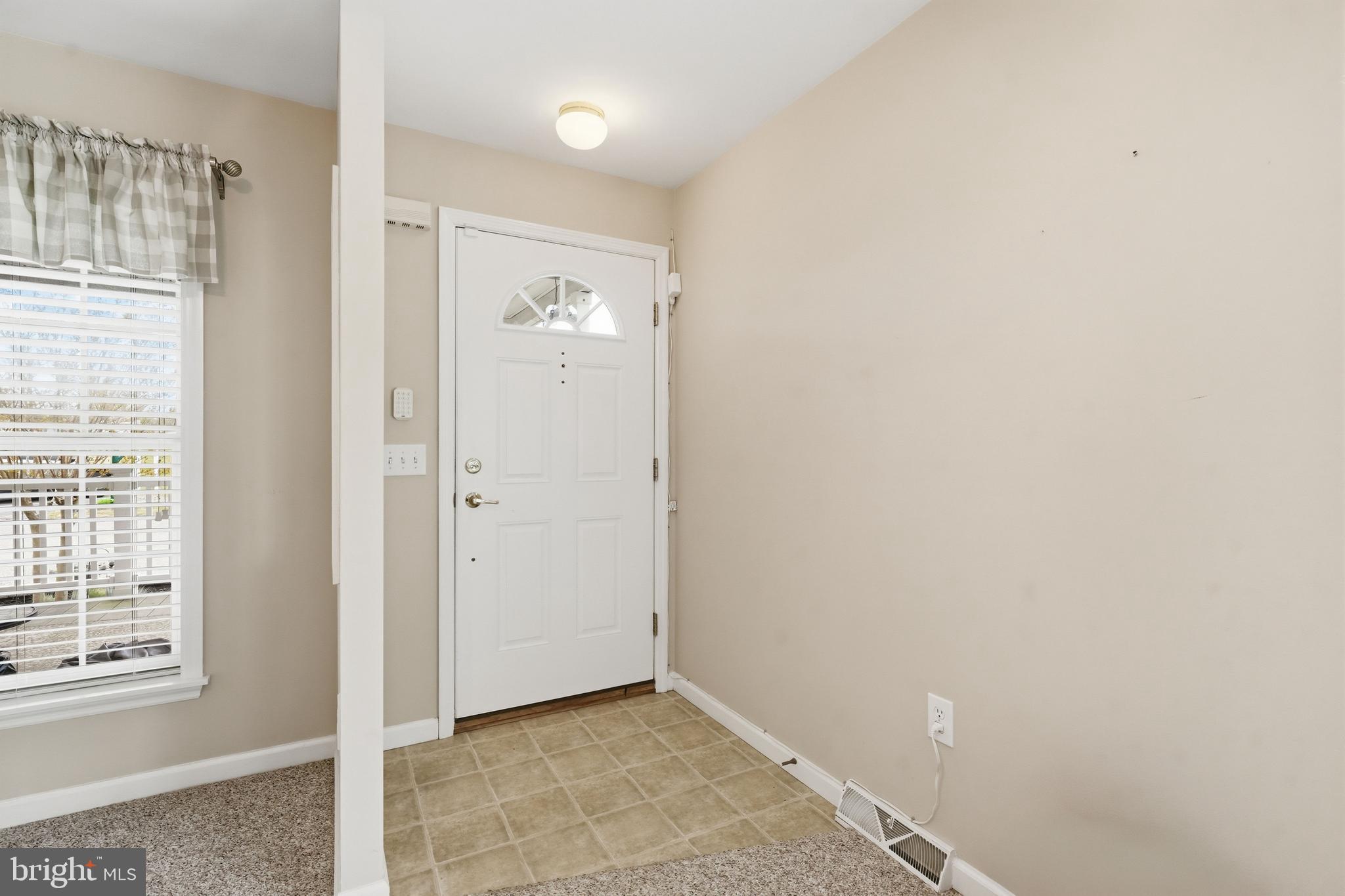 430 Rt Us 9 Street South, Unit 137 Marmora, NJ 08223 - Photo 4 of 24 an empty room with windows