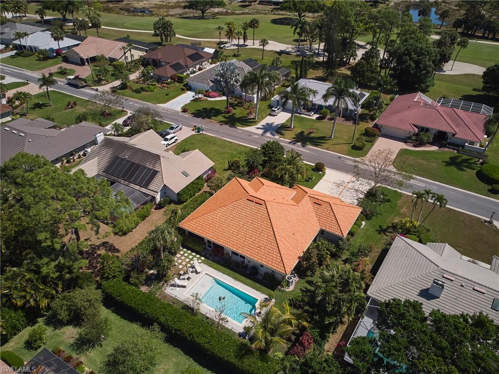 186 Muirfield Circle Naples, FL 34113 - Photo 4 of 36 an aerial view of residential houses with outdoor space