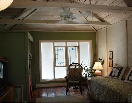 a bedroom with furniture and a window