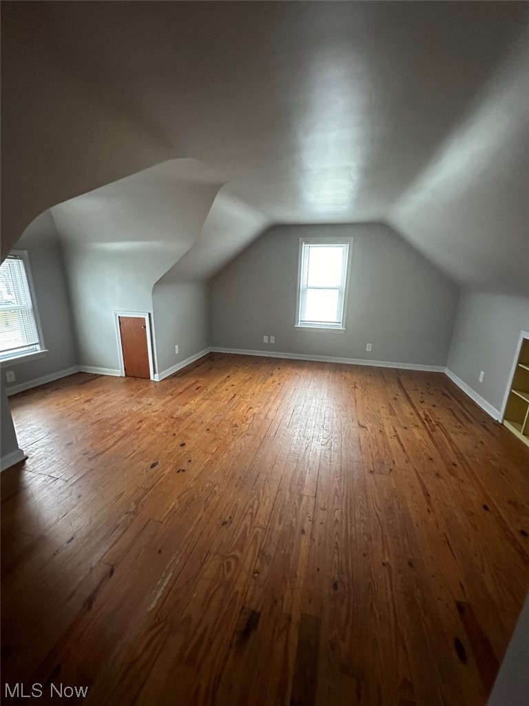 4994 North Barton Road Cleveland, OH 44124 - Photo 10 of 28 Bonus room featuring a wealth of natural light, light wood-type flooring, and vaulted ceiling