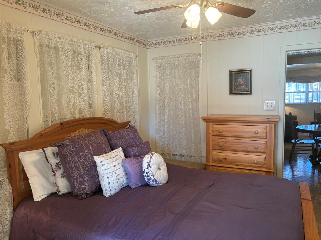 409 East Truett Street Winters, TX 79567 - Photo 12 of 21 Bedroom 2 with en-suite bath.