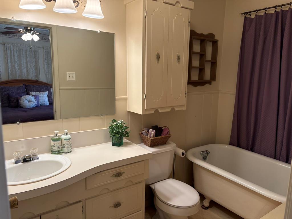 409 East Truett Street Winters, TX 79567 - Photo 14 of 21 Bath 2 is en-suite to bedroom 2!