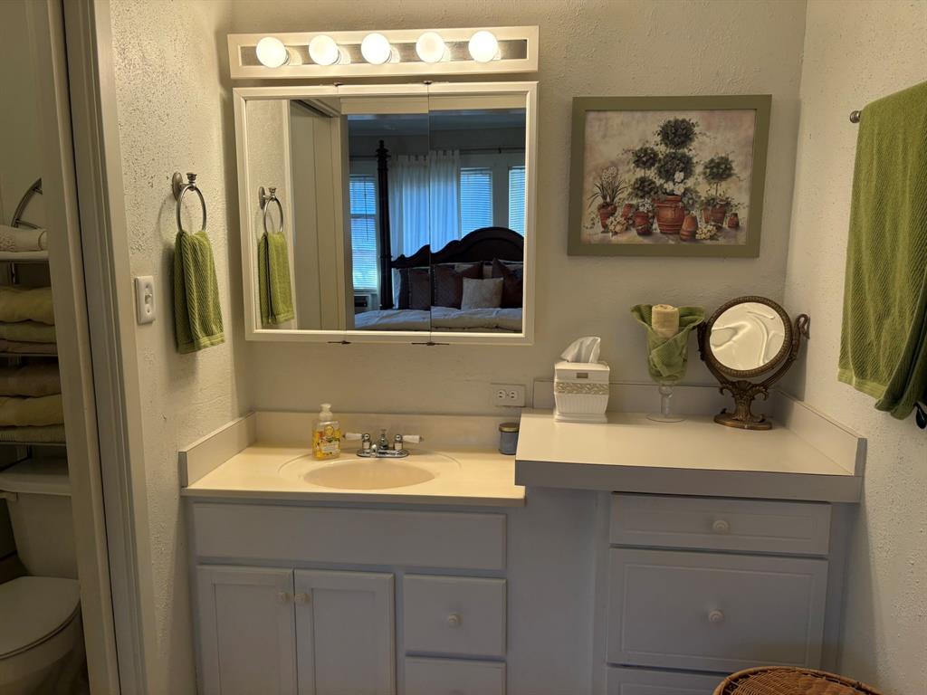 409 East Truett Street Winters, TX 79567 - Photo 10 of 21 Great lighting in this en-suite bath.