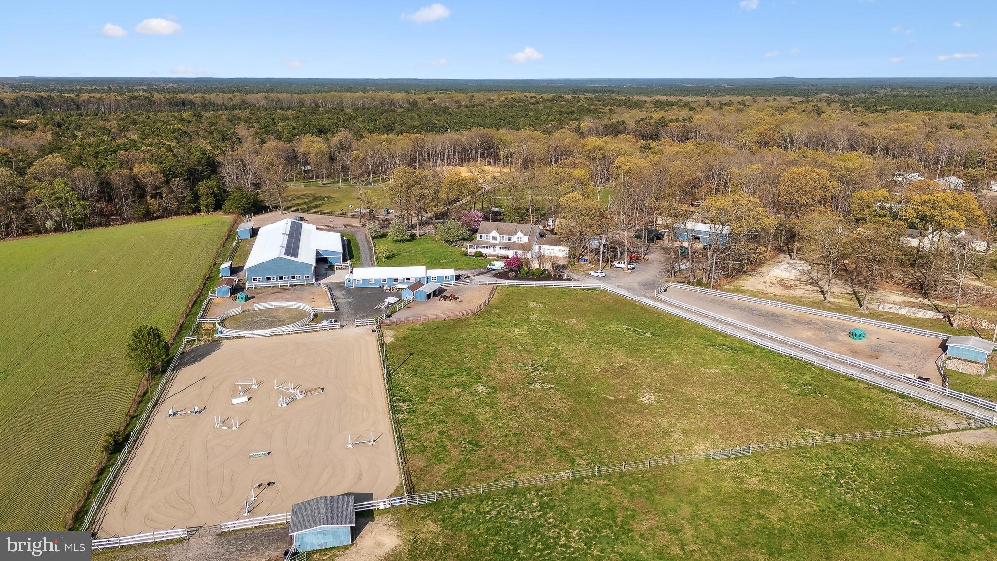 an aerial view of a house with a swimming pool