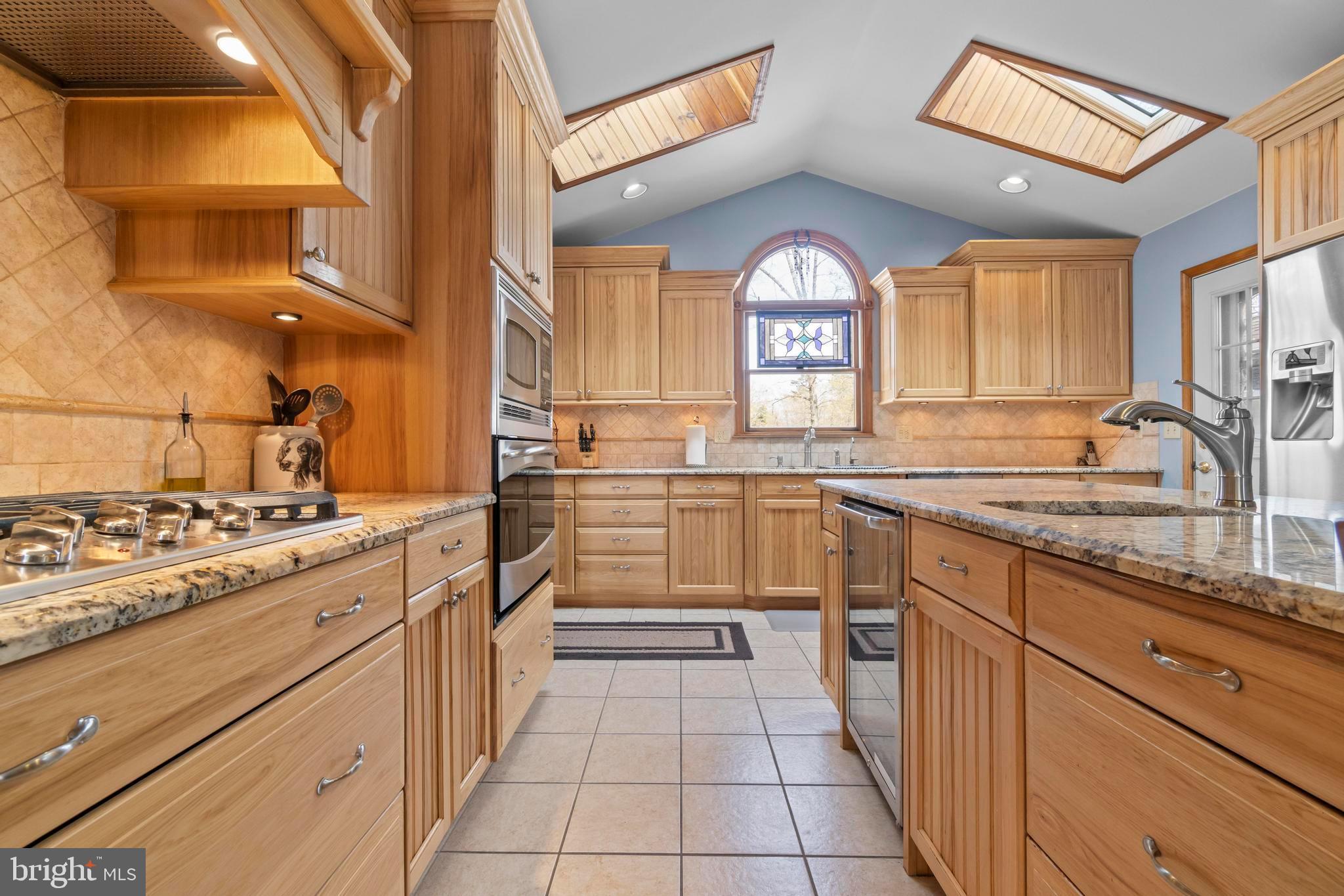 24 Oriental Road Shamong, NJ 08088 - Photo 16 of 67 a kitchen with granite countertop a sink and a stove