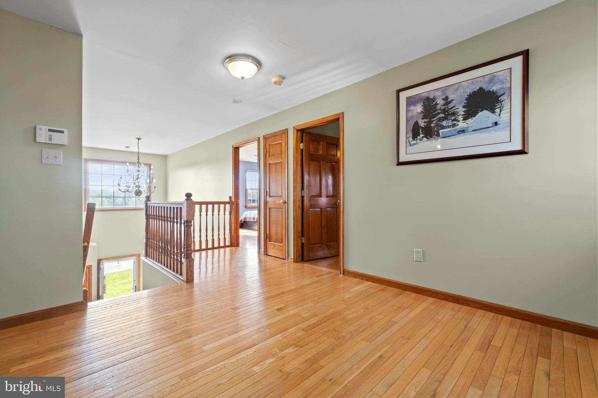 24 Oriental Road Shamong, NJ 08088 - Photo 34 of 67 a view of an empty room with wooden floor and a window