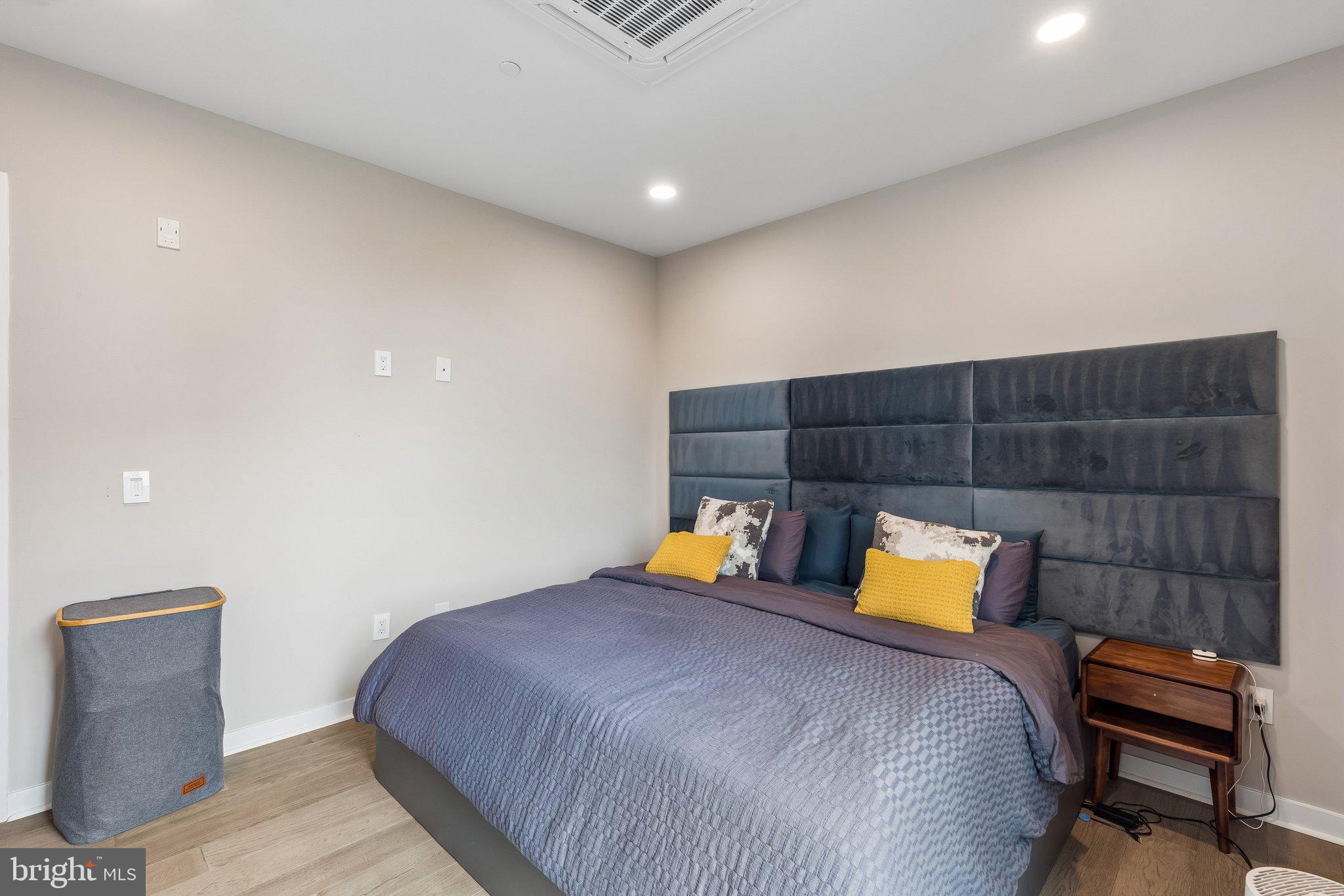 1648-50 Ridge Avenue, Unit 302 Philadelphia, PA 19130 - Photo 20 of 38 a bedroom with a bed and a couch